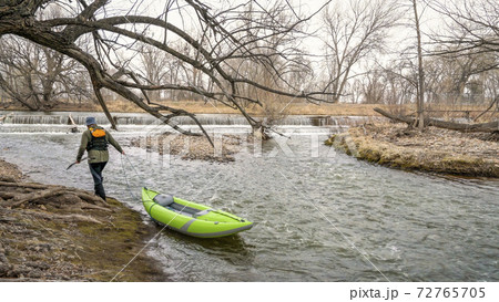 paddler with whitewater inflatable kayak paddler with whitewater inflatable kayak 72765705