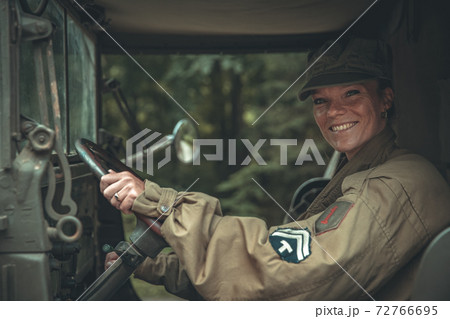 woman in a military uniform in an army car 72766695