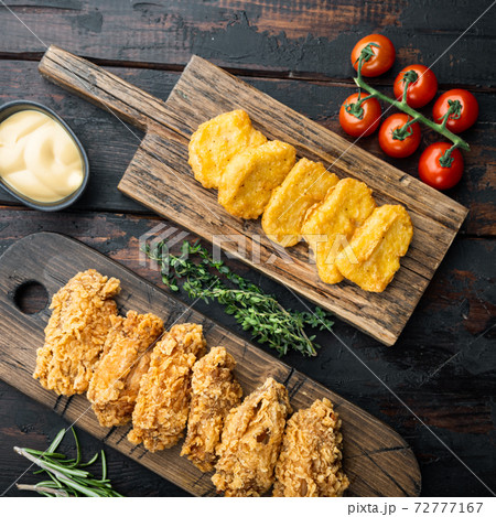 Korean barbeque fried chicken on old dark wooden table, flat lay Korean barbeque fried chicken on old dark wooden table, flat lay 72777167