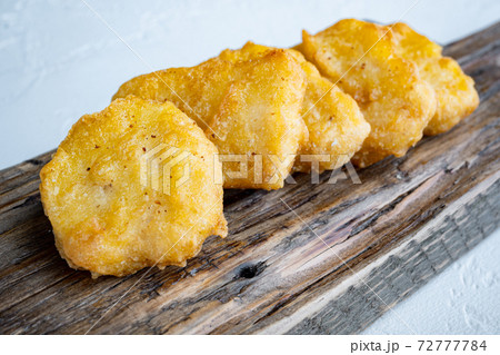 Fried crispy chicken nuggets on white background 72777784