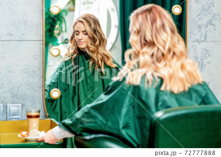 Young woman in beauty salon. 72777888