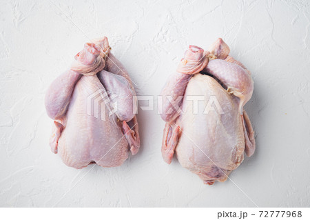Raw small young chicken, on white background, top view 72777968