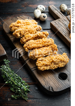 Fried chicken wings on dark wooden background 72778518
