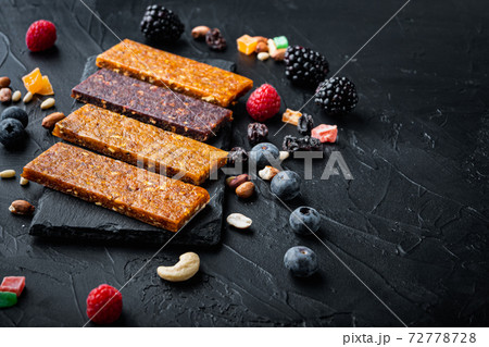 Dried fruits bars with copy space,on black background 72778728