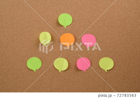 multicolored round sticks are glued to the brown cork board multicolored round sticks are glued to the brown cork board 72783563