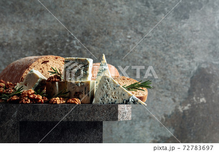 Blue cheese with walnuts, bread, and rosemary. Blue cheese with walnuts, bread, and rosemary. 72783697