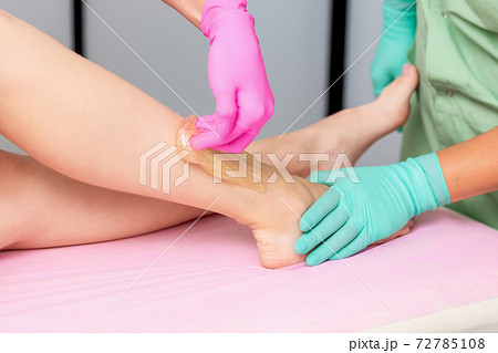 Hands waxing legs. Hands waxing legs. 72785108