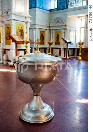 the baptismal font in the Orthodox Church with cover of with a handle the baptismal font in the Orthodox Church with cover of with a handle 72786446