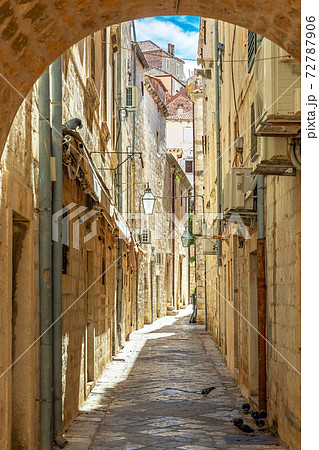Dubrovnik, Croatia. Dubrovnik old street view with lanterns through the arch. 72787906