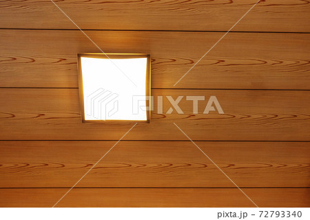 和室の木目調の天井と照明器具の写真素材