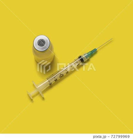Studio shot of laboratory vial and syringe Studio shot of laboratory vial and syringe 72799969