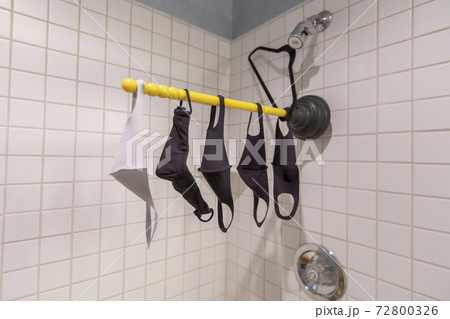 Fabric protective masks against coronavirus drying in home shower Fabric protective masks against coronavirus drying in home shower 72800326