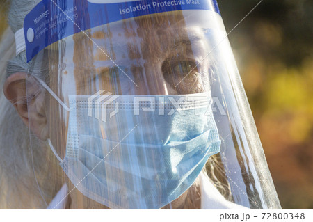 Portrait of senior female medical staff in covid protective clothing 72800348