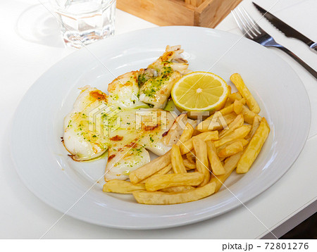 Grilled cuttlefish with fries and green sauce Grilled cuttlefish with fries and green sauce 72801276