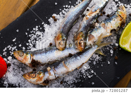 Baked pilchards on sea salt Baked pilchards on sea salt 72801287