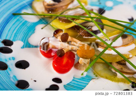 Pieces of potato with champignons Pieces of potato with champignons 72801383