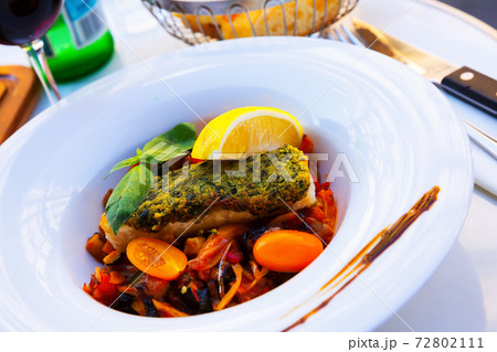 White fish baked with vegetables White fish baked with vegetables 72802111