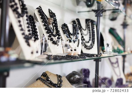 Counter with onyx jewelry in store 72802433