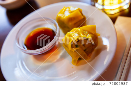 Chinese dish - dumplings shumai with soy sauce Chinese dish - dumplings shumai with soy sauce 72802987