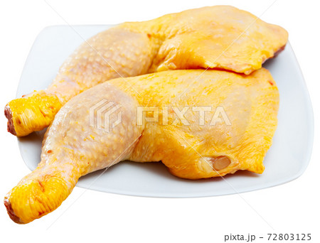Raw chicken legs isolated over white Raw chicken legs isolated over white 72803125