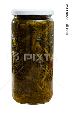 Canned green spinach in glass jar 72803358
