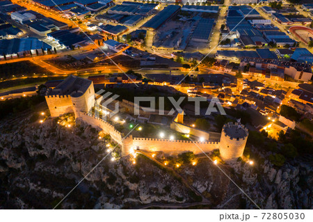 Aerial view of fortified Castalla Castle on stone hill in twilight, Spain 72805030