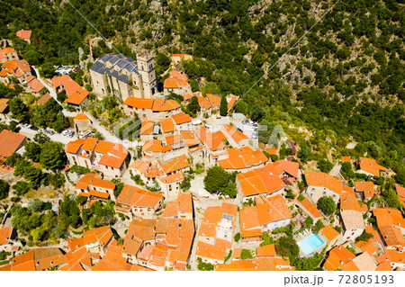 Summer view of French village of Eus with medieval church Summer view of French village of Eus with medieval church 72805193