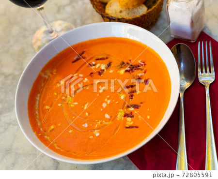White ceramic bowl with salmorejo cordobes, typical spanish tomato soup similar to the gazpacho White ceramic bowl with salmorejo cordobes, typical spanish tomato soup similar to the gazpacho 72805591