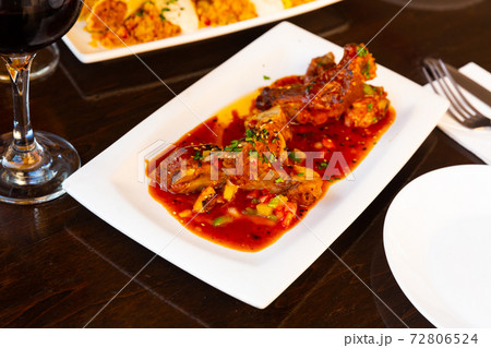 Asian sticky pork ribs on plate closeup Asian sticky pork ribs on plate closeup 72806524