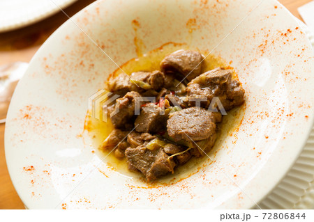 Appetizing lamb stewed with young garlic and paprika Appetizing lamb stewed with young garlic and paprika 72806844