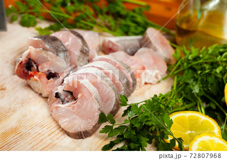 Raw haddock on wooden table Raw haddock on wooden table 72807968