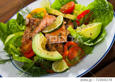 Light tasty salad of grilled trout fillet 72808239
