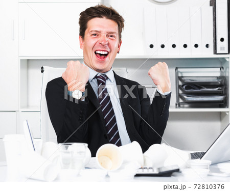 Businessman enjoying excellent results 72810376