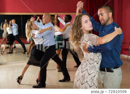 People dancing slow ballroom dances in pairs People dancing slow ballroom dances in pairs 72810506