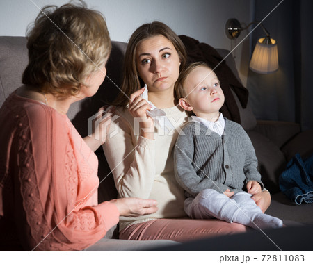 Aged woman is comforting emotional daughter after watching film Aged woman is comforting emotional daughter after watching film 72811083