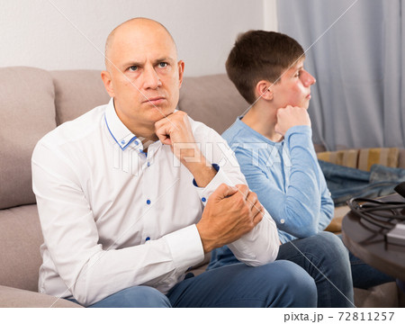 Man and his son offended at each other 72811257