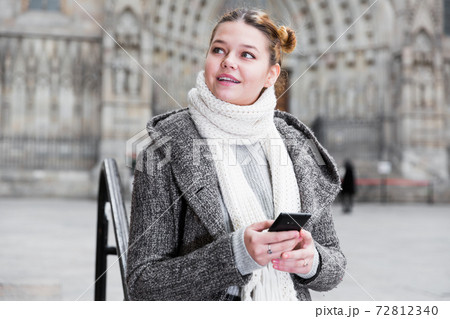 girl using mobile phone in scarf girl using mobile phone in scarf 72812340