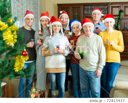 Portrait of happy big family celebrating Christmas holidays at home Portrait of happy big family celebrating Christmas holidays at home 72813437