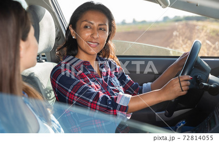 Latino and caucasian women travelling by car 72814055