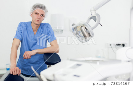 Male dentist is ready to accept client in clinic 72814167