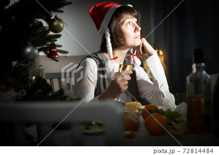 Sad girl celebrates New Year alone Sad girl celebrates New Year alone 72814484