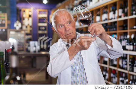 Wine producer inspecting quality of wine Wine producer inspecting quality of wine 72817100