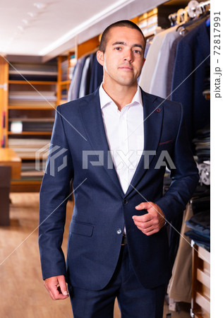 Man trying on new suit in store Man trying on new suit in store 72817991