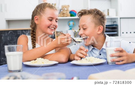 Friends are feed each other during dinner Friends are feed each other during dinner 72818300
