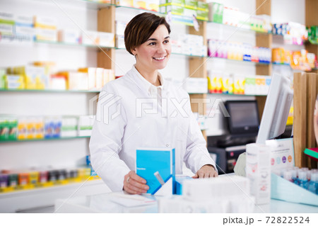Pharmacist ready to assist in choosing at counter 72822524