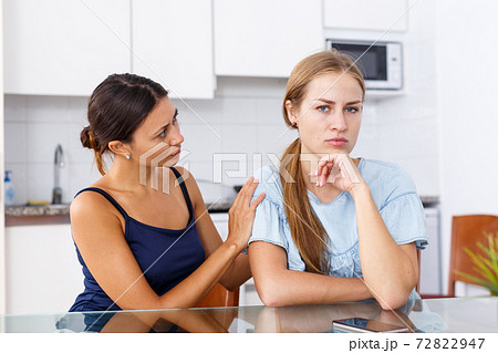 Woman trying to support her sad friend Woman trying to support her sad friend 72822947