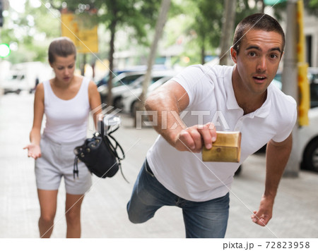 Thief stealing woman purse Thief stealing woman purse 72823958