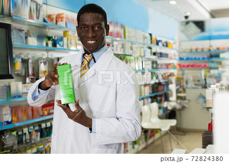 Portrait of experienced male pharmacist counseling about medicines in pharmacy Portrait of experienced male pharmacist counseling about medicines in pharmacy 72824380