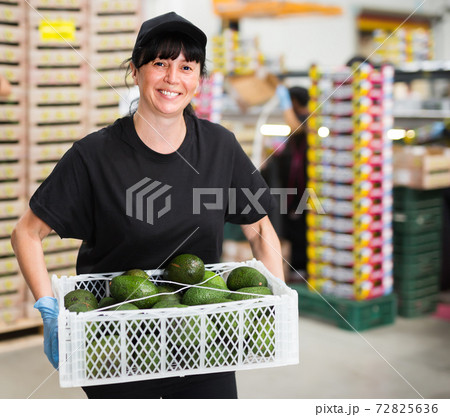 Nice woman working at fruit warehouse 72825636