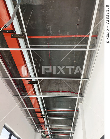 KUALA LUMPUR, MALAYSIA -APRIL 26, 2020: Installation of suspended ceiling frame and finishes. All the above-ceiling services and equipment. installed before that. All the installation work to be coord 72832159
